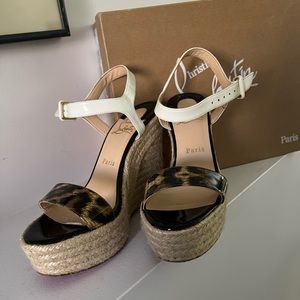 Christian louboutin wedges shoes .